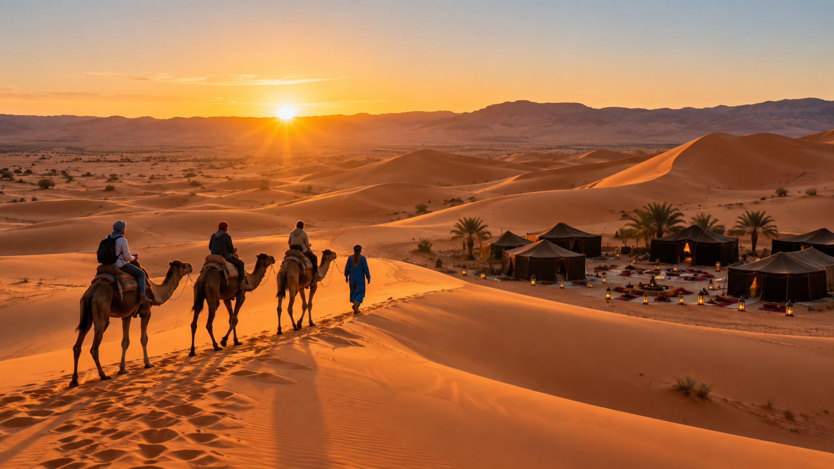 Camel caravan and Sahara desert camp at sunset, Morocco